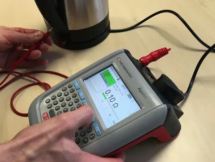 Engineer Testing an Appliance in a Rental Property